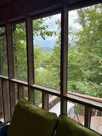 Front Porch View, has screened in porch, hot tub, outside dining