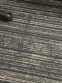 Worn out and sticky carpet.