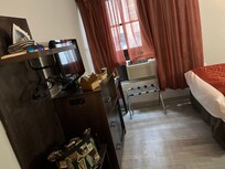 Clothing rack, mini fridge, room, safe and desk with no electrical outlet for coffee maker. No microwave.
