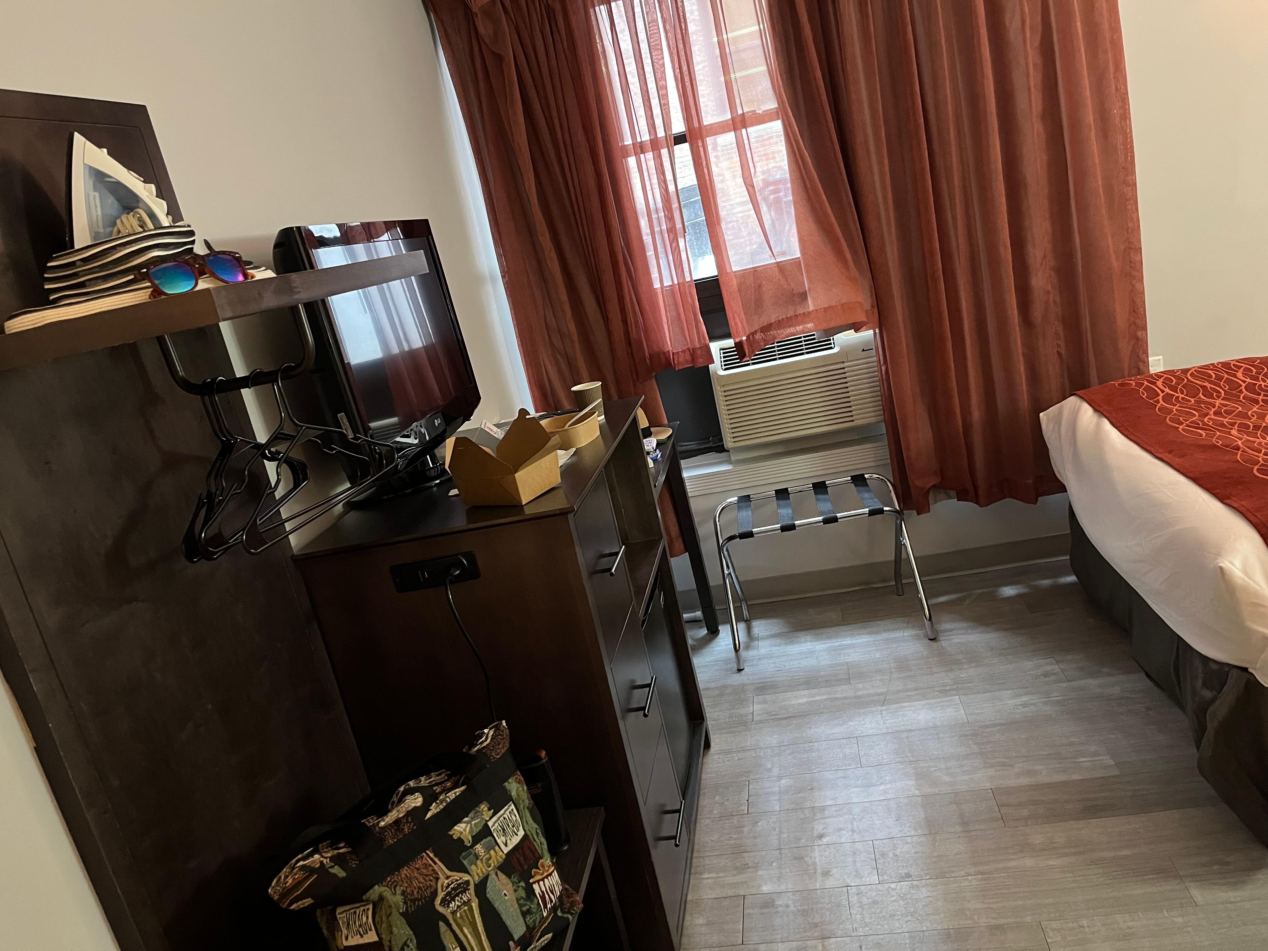 Clothing rack, mini fridge, room, safe and desk with no electrical outlet for coffee maker. No microwave.