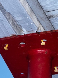 Back porch jacked to secure