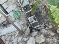 The entrance. Is unkempt, there is NO light ar night. Rough broken stone surface unsafe without light.