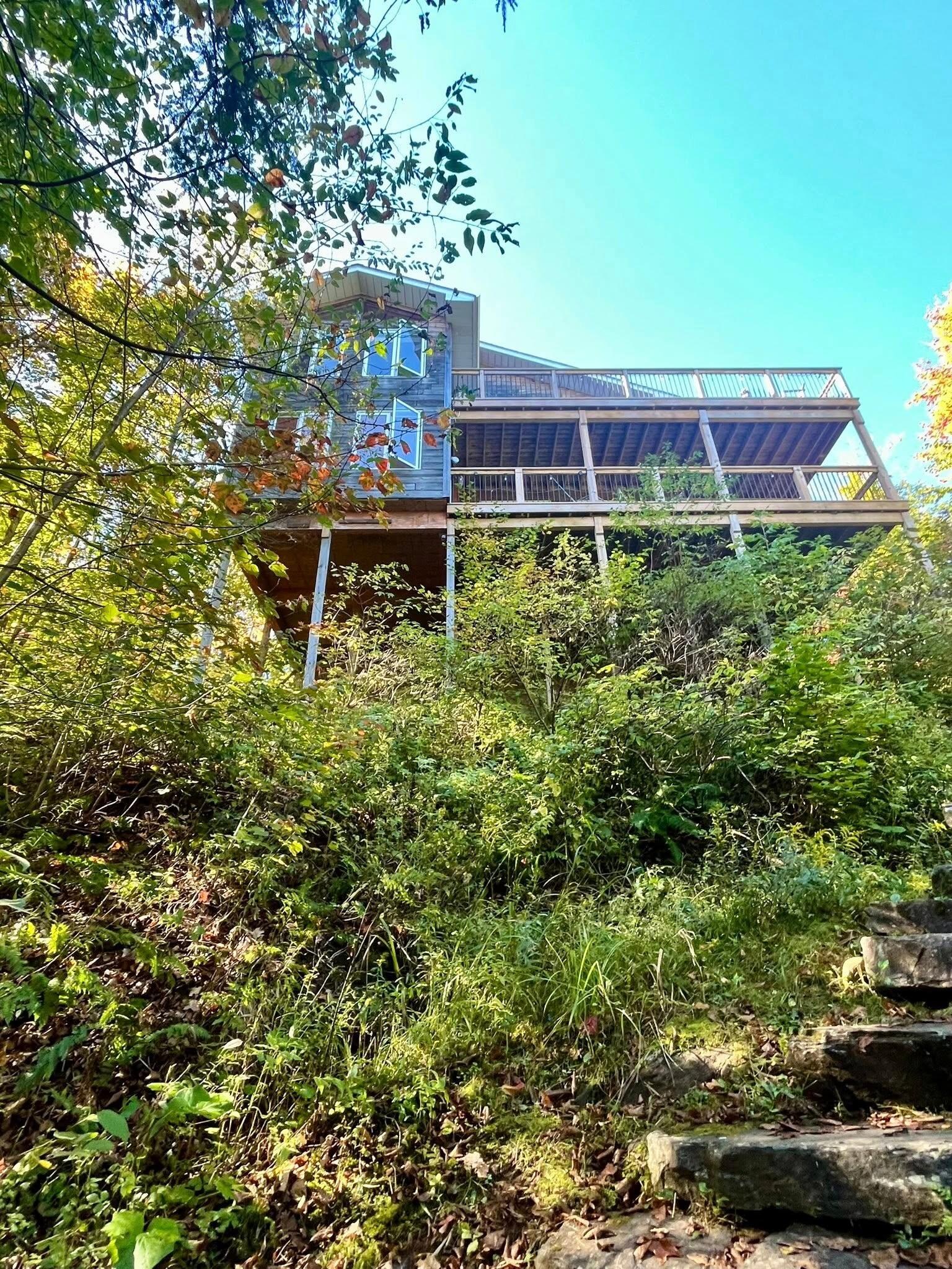 The cottage overlooks the lake.
