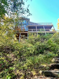 The cottage overlooks the lake.