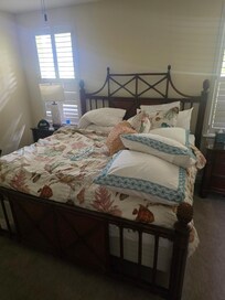 Unmade bed of person living in unit