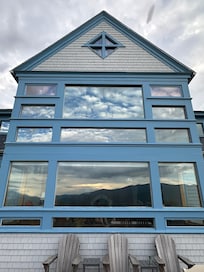 Mount Waumbek and Mount Starr King reflection in the window.