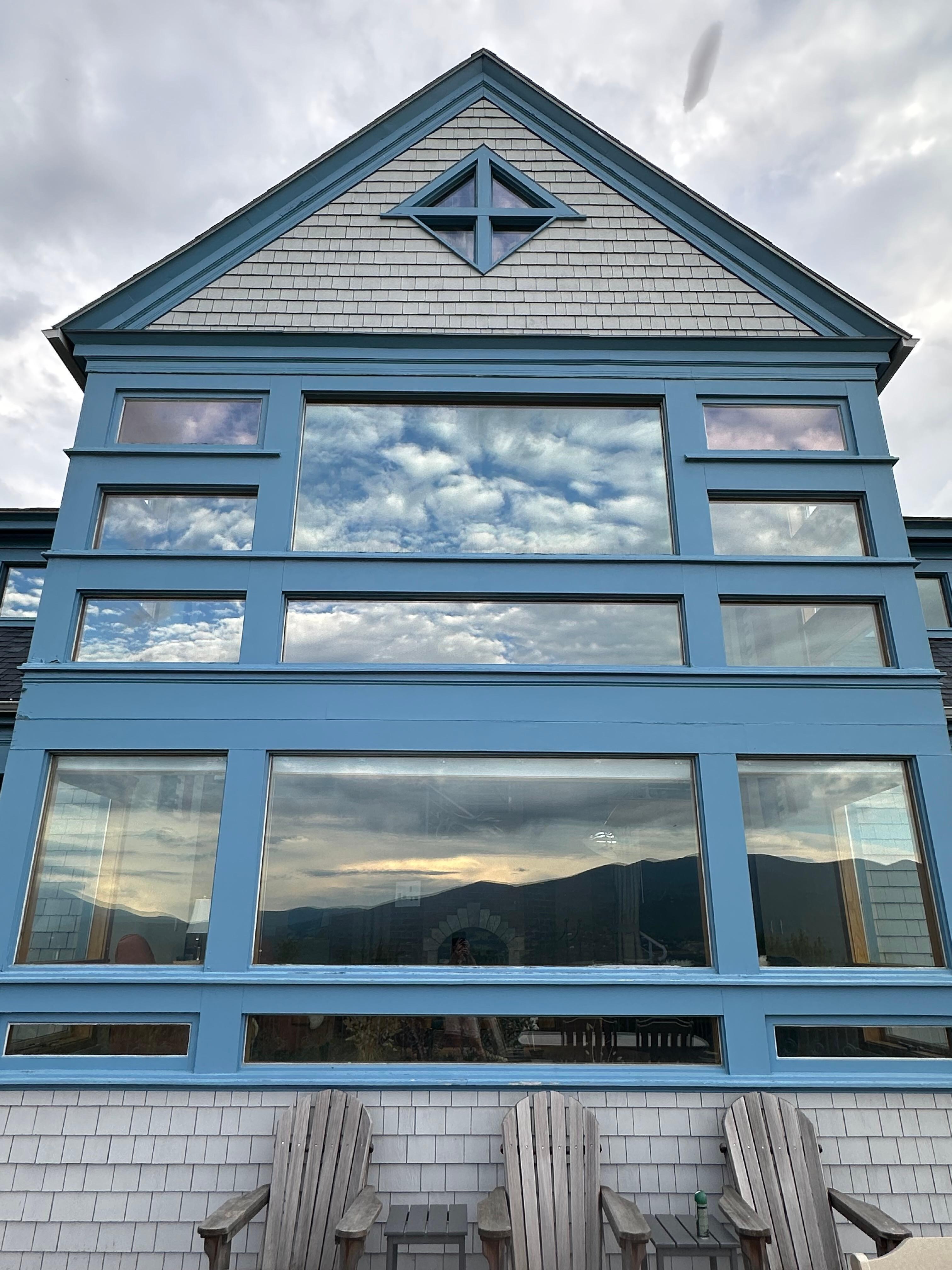 Mount Waumbek and Mount Starr King reflection in the window.