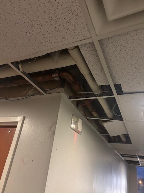 Missing ceiling tiles in the hallway