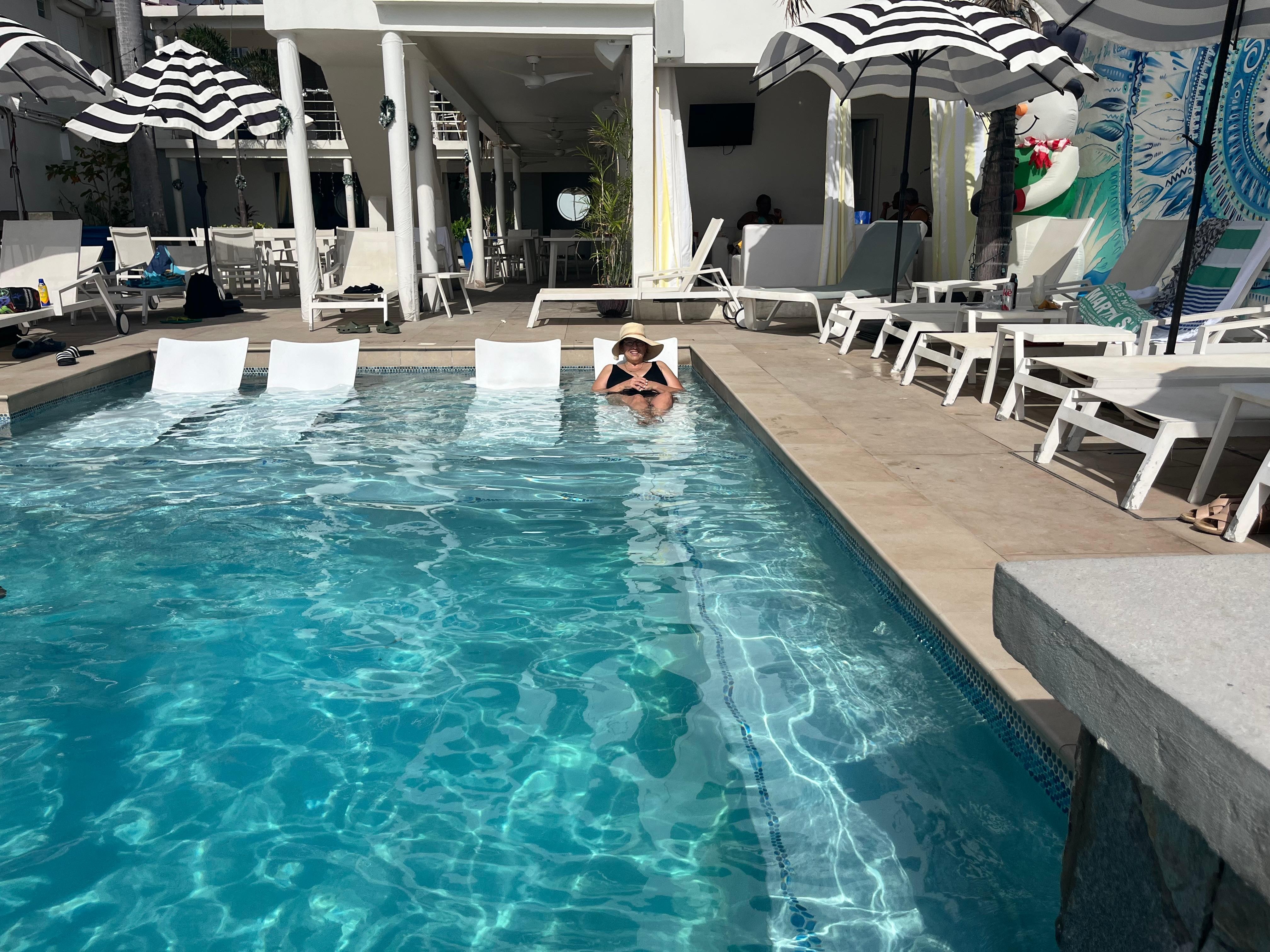 Pool with loungers in water