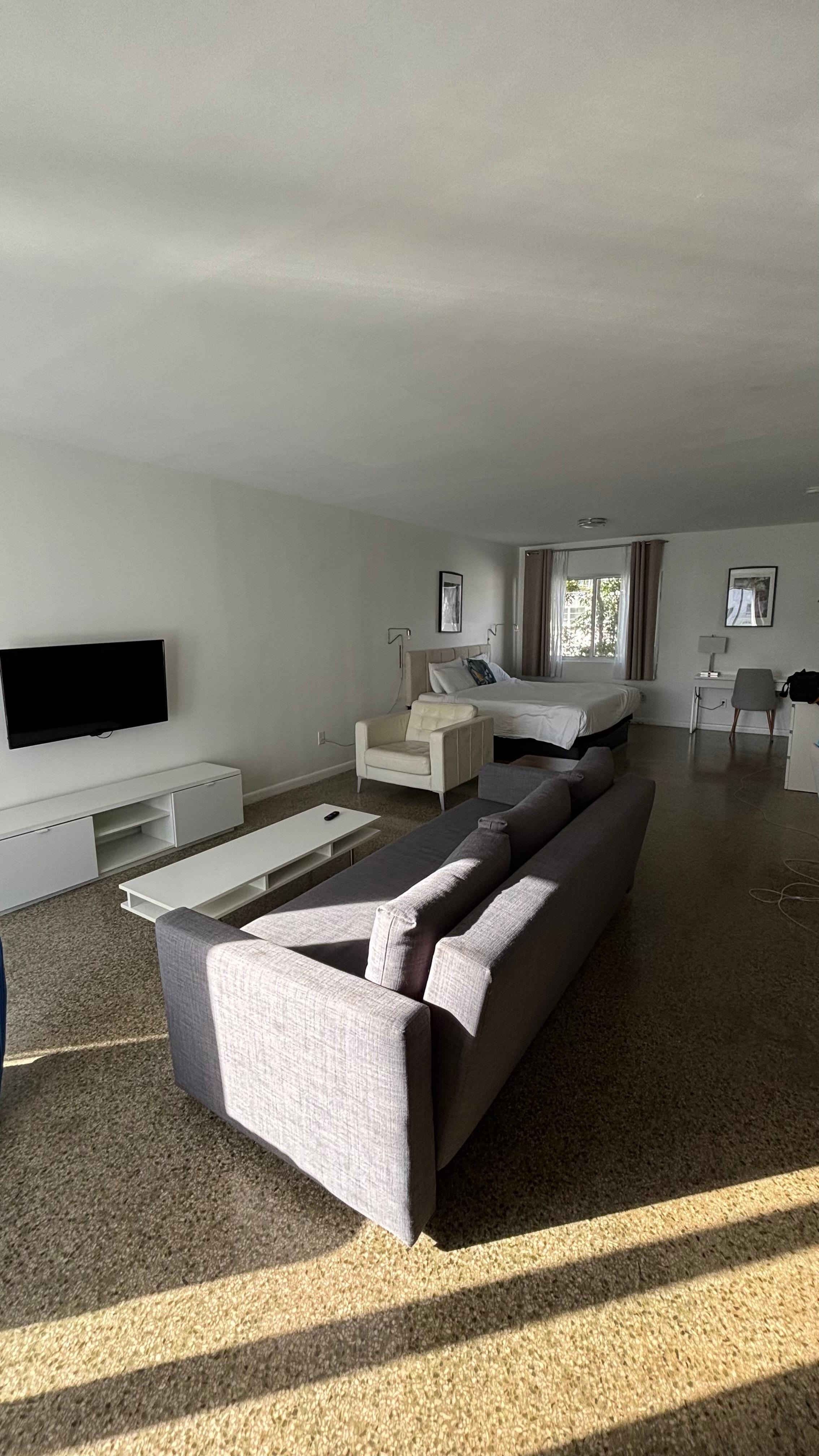 Living room with bed.