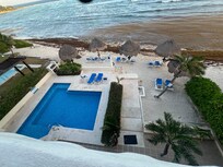 View from balcony of the pool and beach