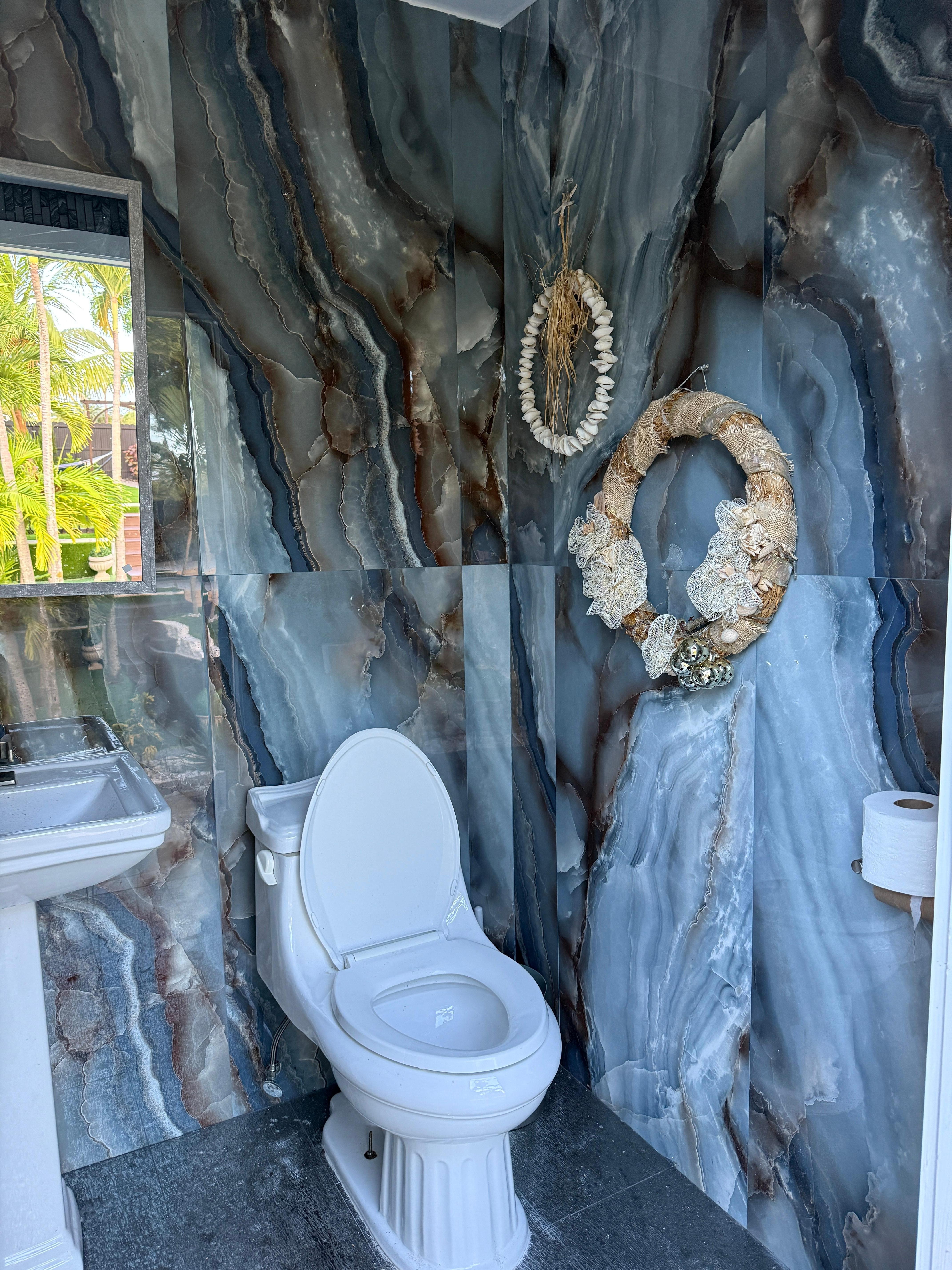 This is the outdoor bathroom that wasn’t in the description...nice surprise.... We don’t need to go inside the house while enjoying the pool.