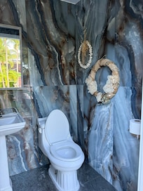 This is the outdoor bathroom that wasn’t in the description...nice surprise.... We don’t need to go inside the house while enjoying the pool.