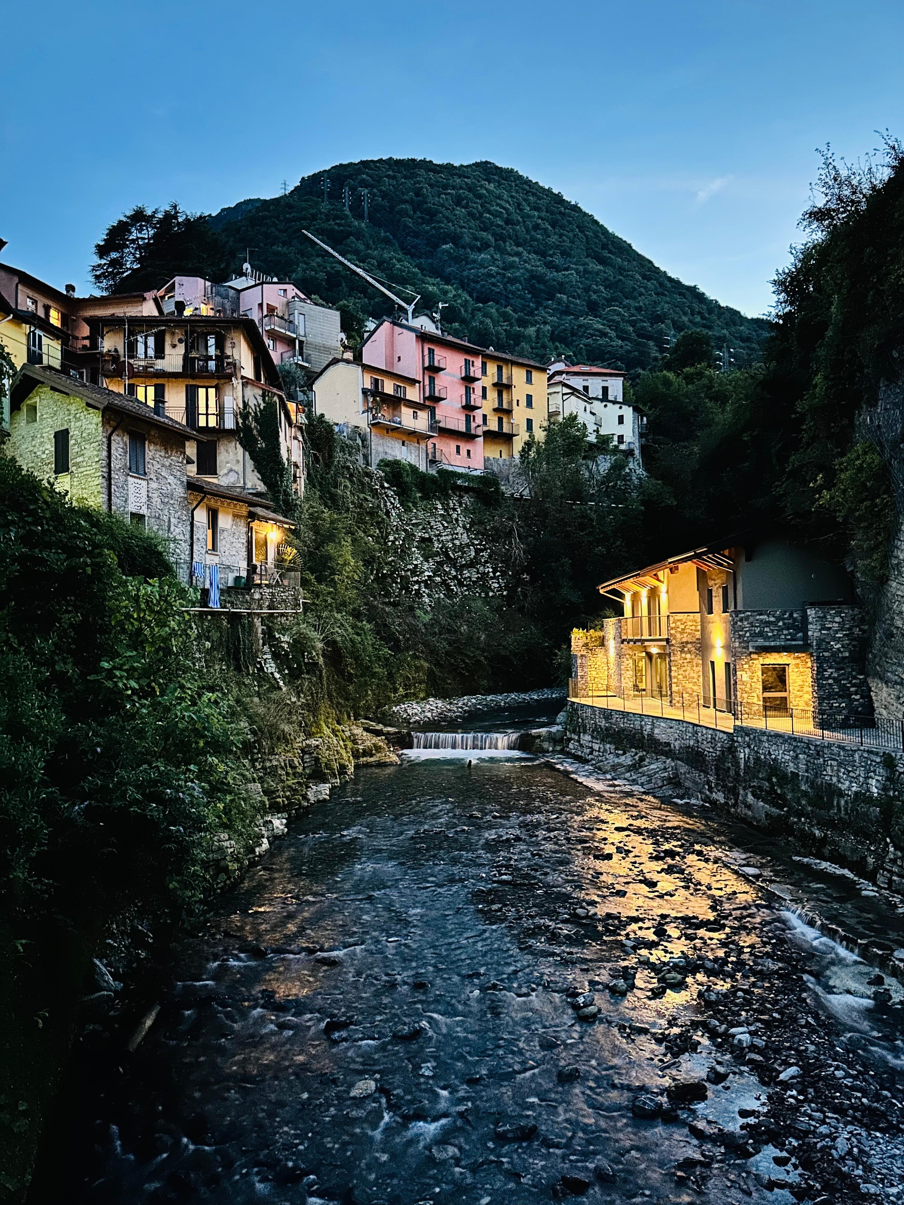 beautiful little waterfront town with a mountain stream