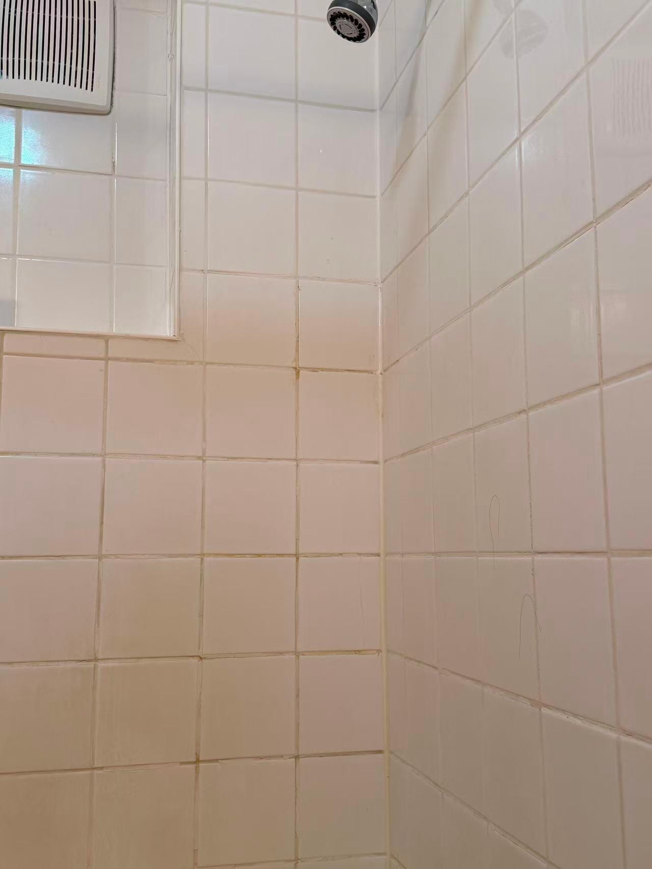 yellow/orange stains between the tiles