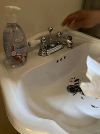 Clogged sink w scum and other people hair