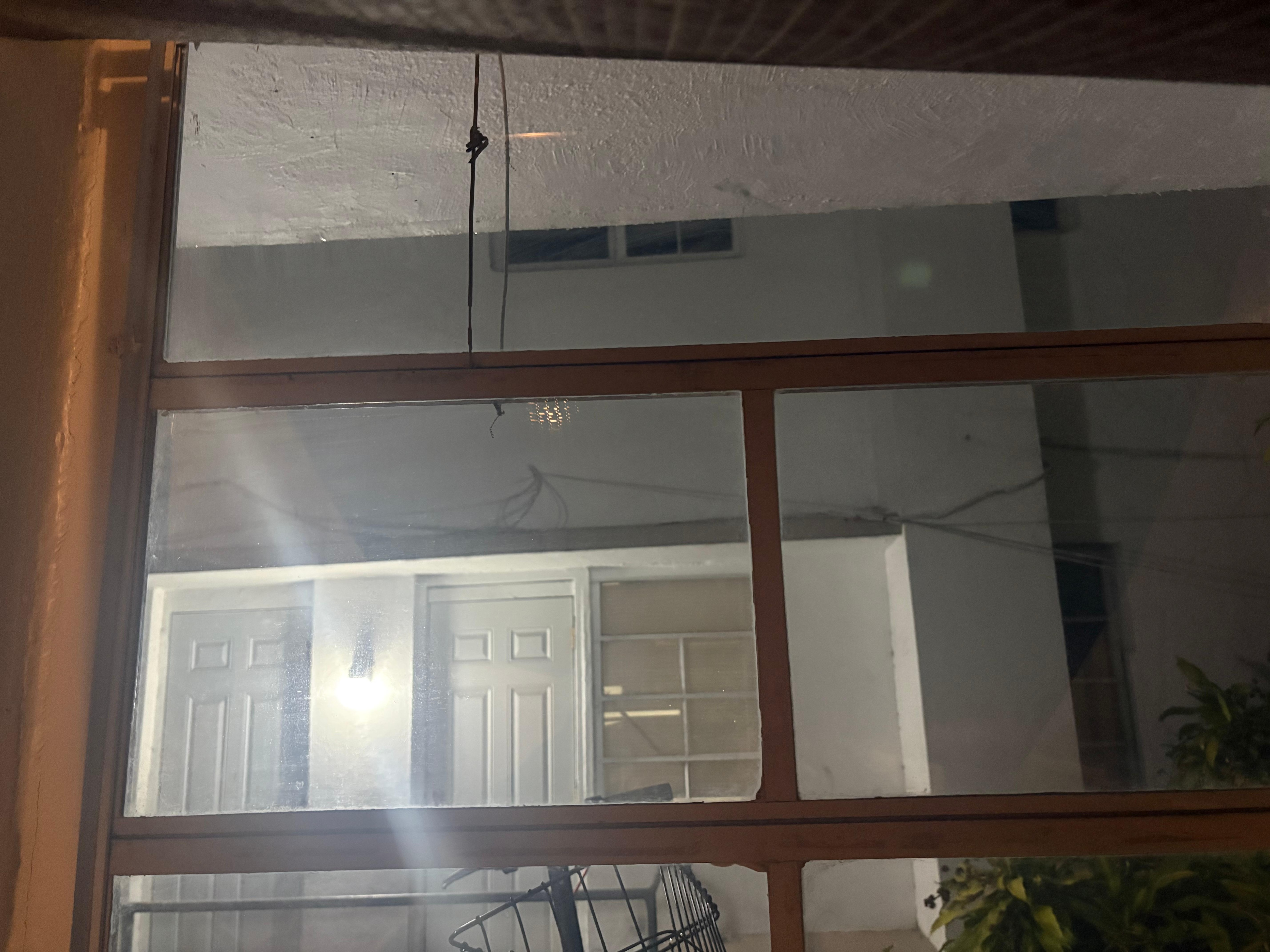 Hanger holding kitchen window