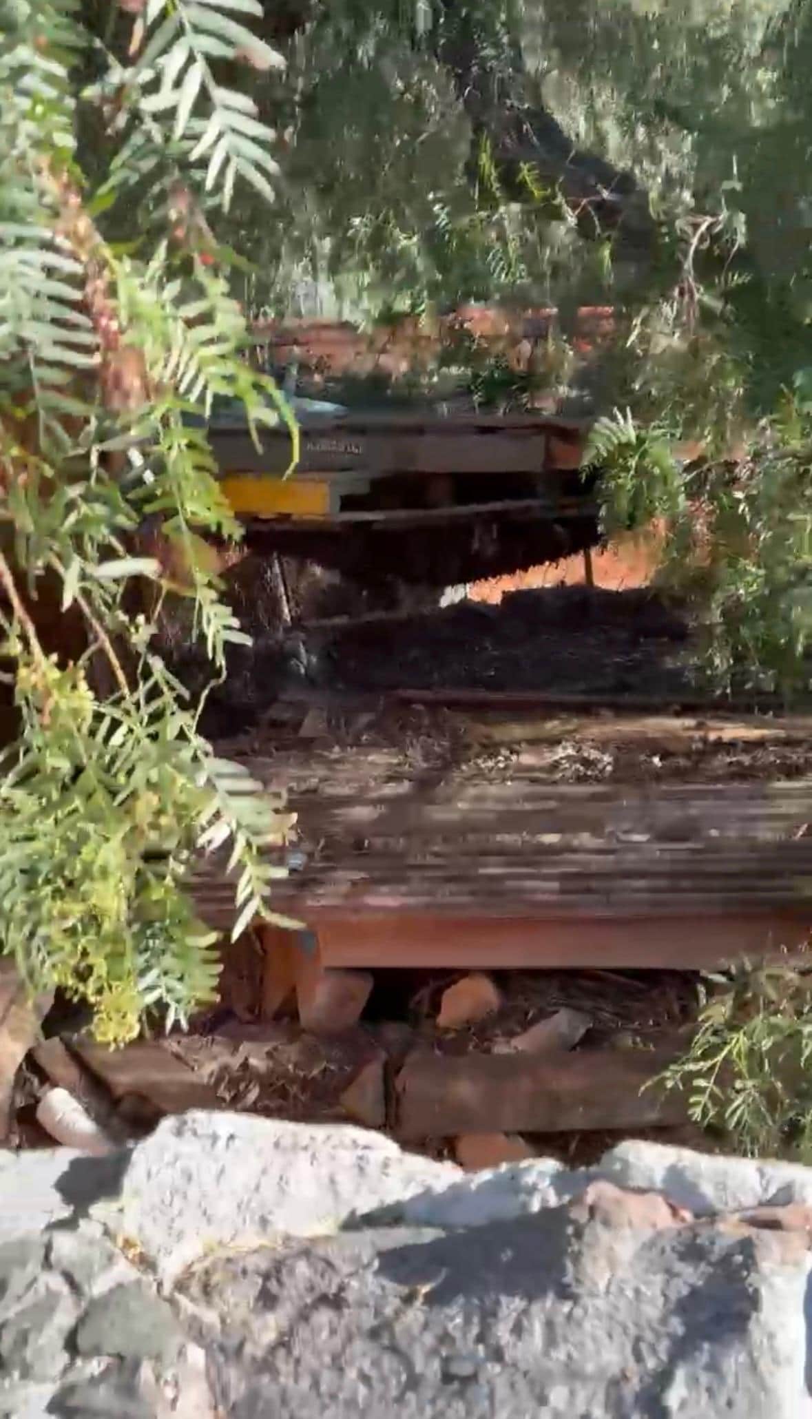 Cages behind the stone wall beside the Giant Chess ♟️ Board 