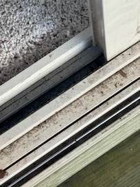 Sliding glass door track