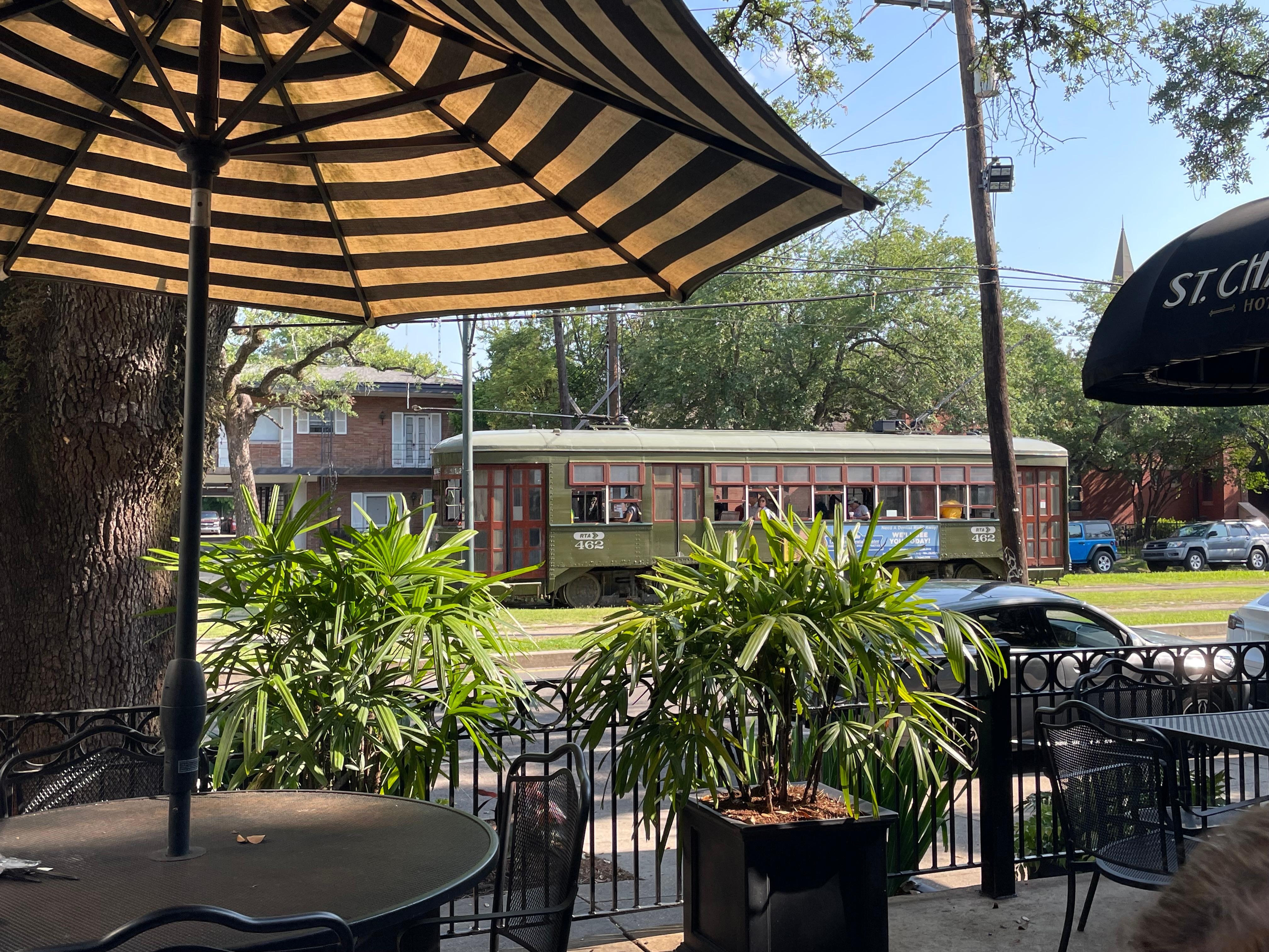Streetcar passing by while enjoying breakfast on the patio
