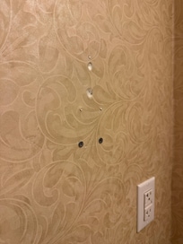 Damage on the wall.