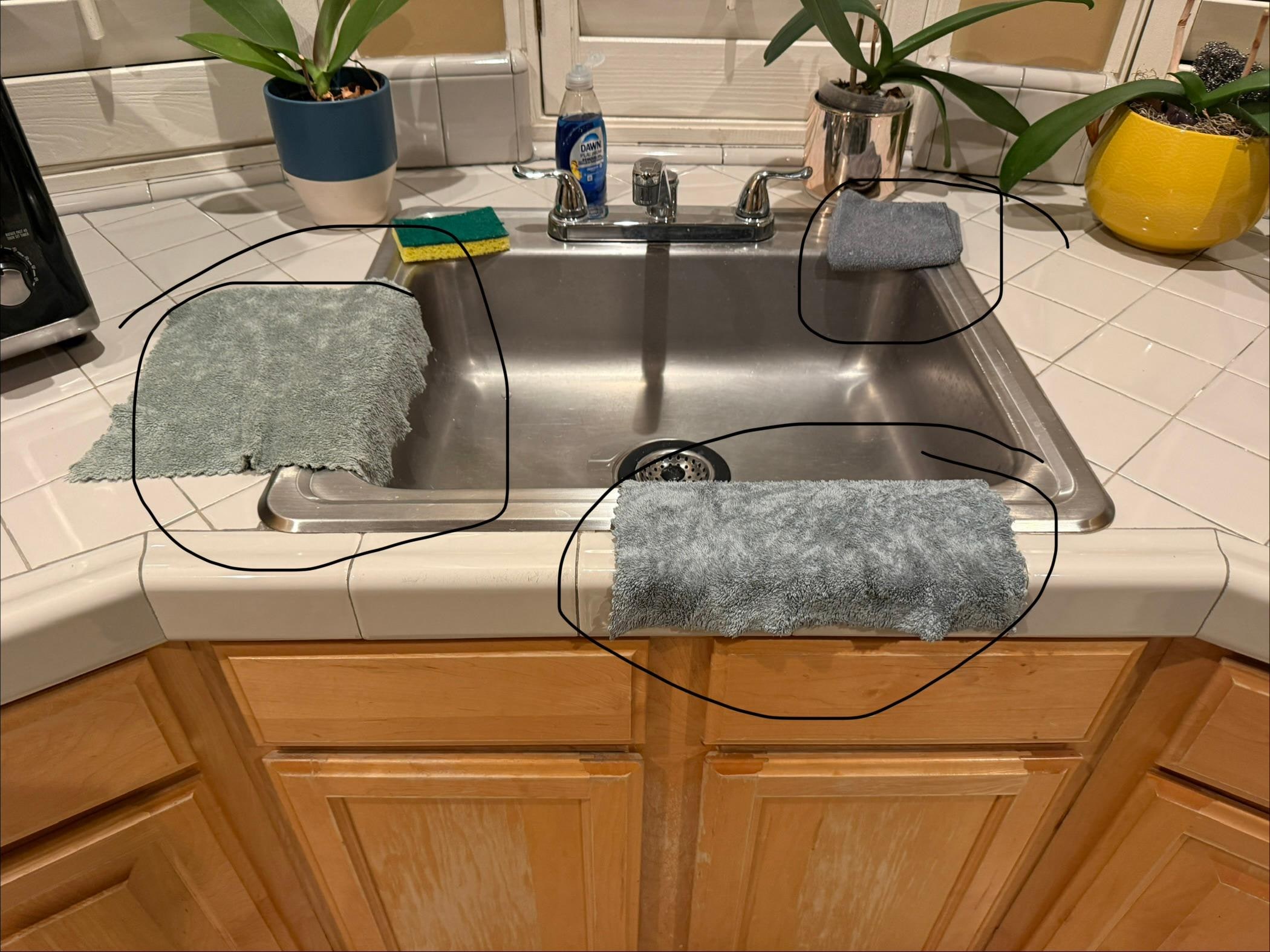 Who leaves dirty kitchen rags on the sink for a new guest