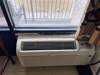 Air conditioning unit held up with tape