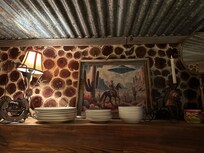 Wood cutting backsplash and fun quirky artwork