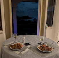 Dinner with view of atlantic ocean lit by moon light