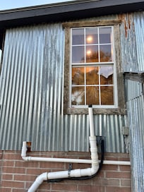 Cottage bathroom sewer pipe vent ends at window. When window opened the smell was disgusting.