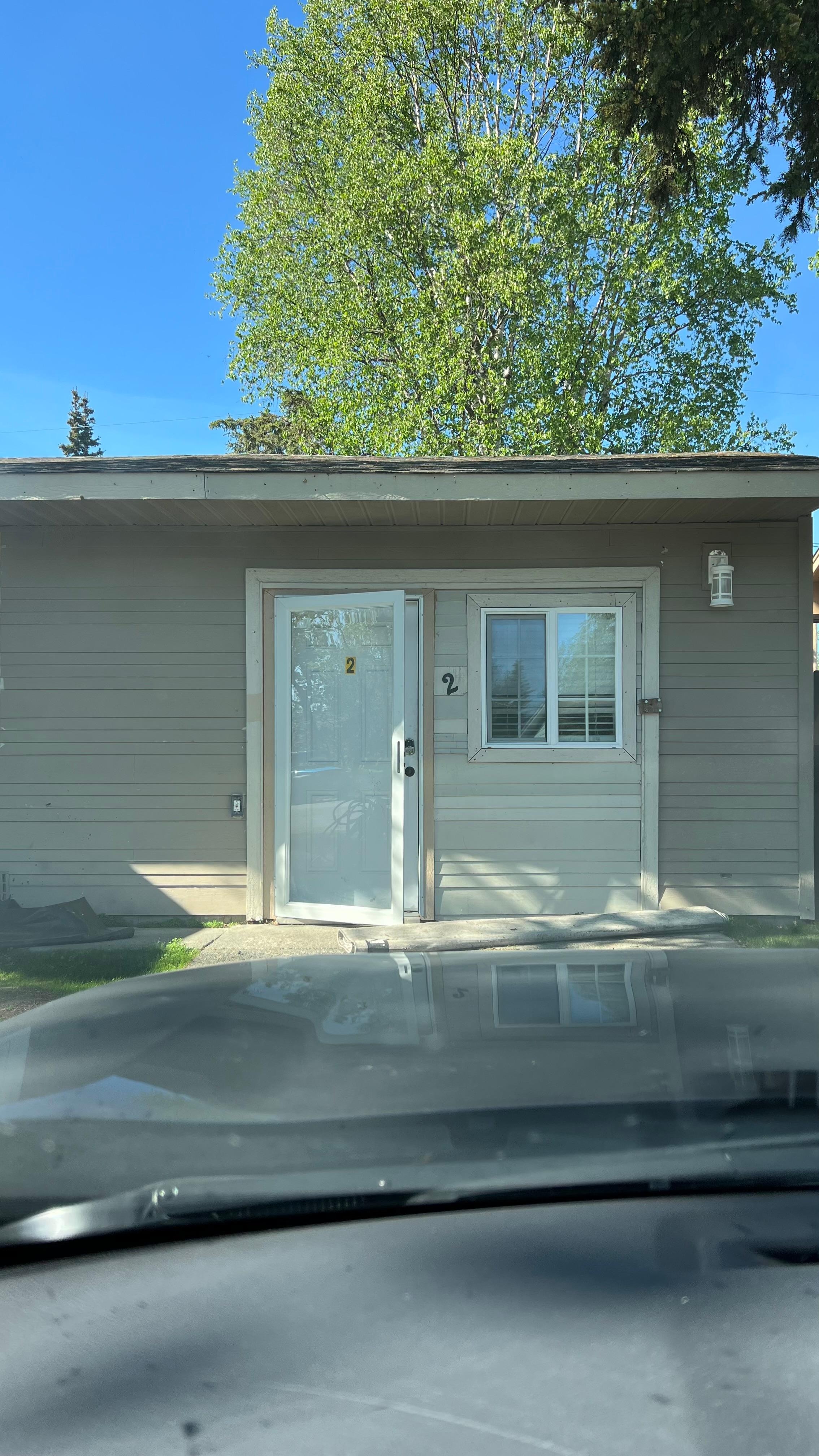 This doesn’t show the rolled up carpet in front of the door.