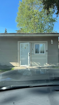 This doesn’t show the rolled up carpet in front of the door.
