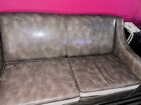 Old Leather Couch with leather falling off & black stained