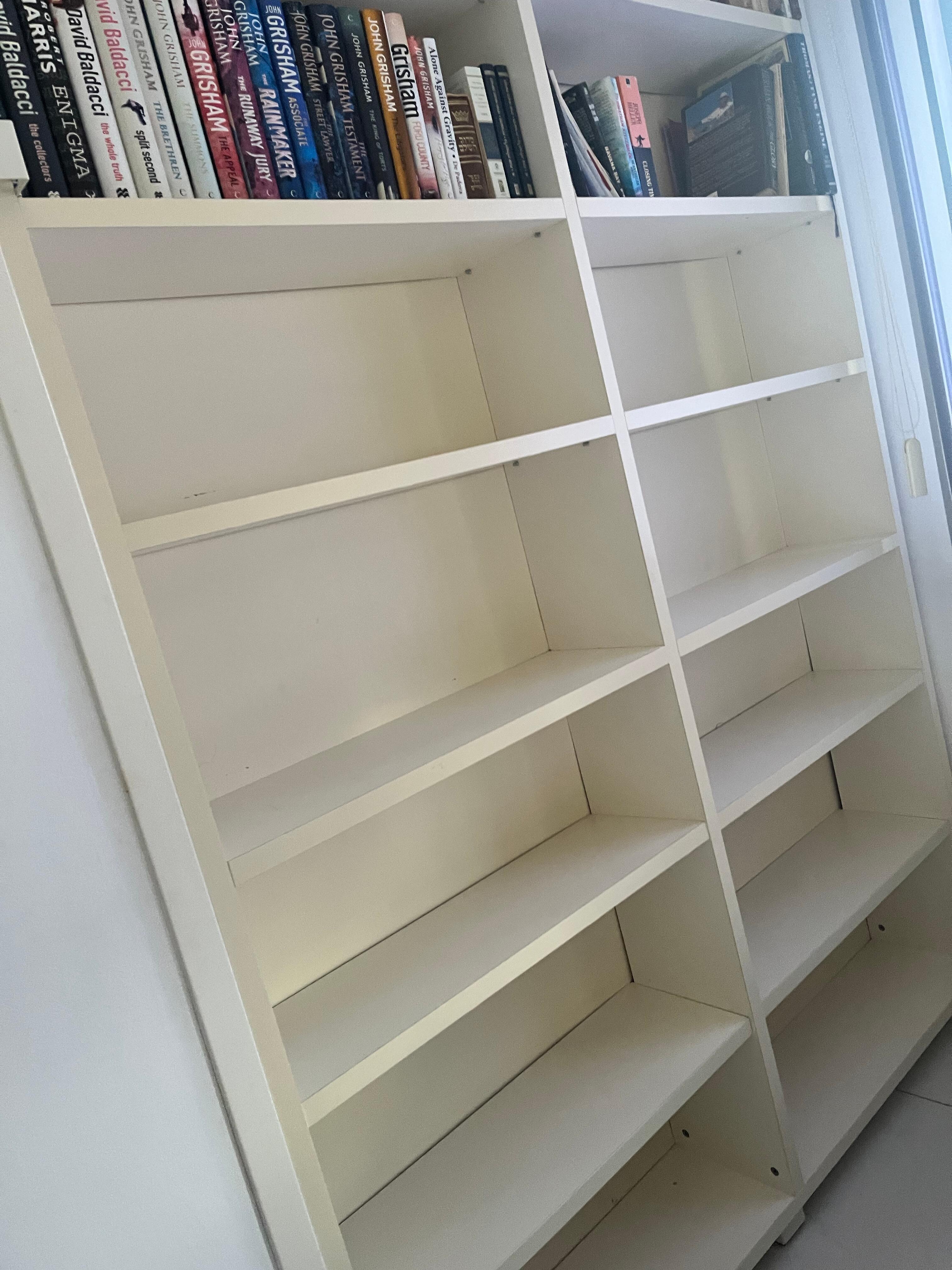 Bedroom with great closet space and great selection of books.