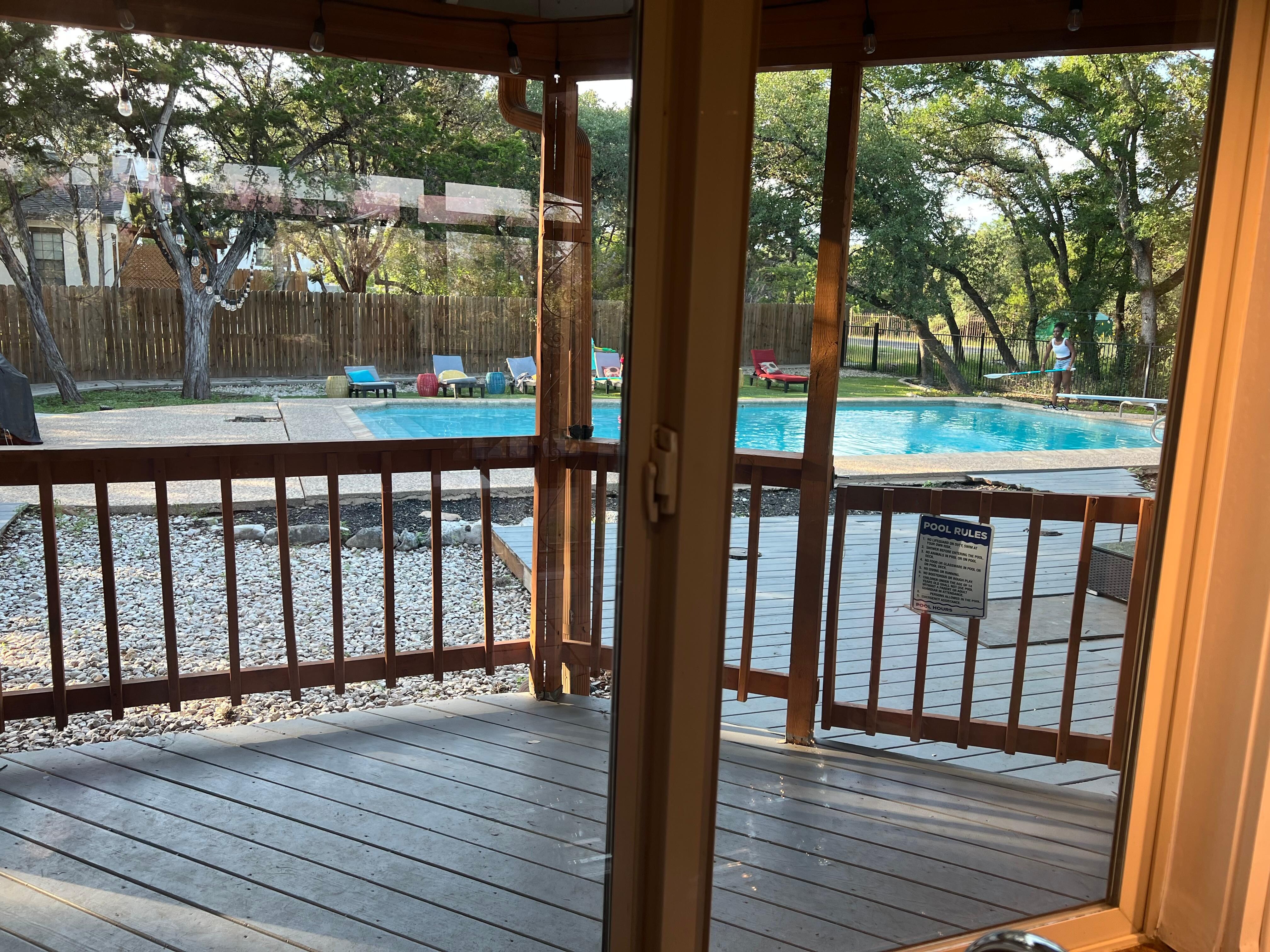 Glimpse of pool area from patio area 