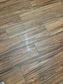 Sticky spot on floor. We cleaned it with a washcloth-which turned it brown.