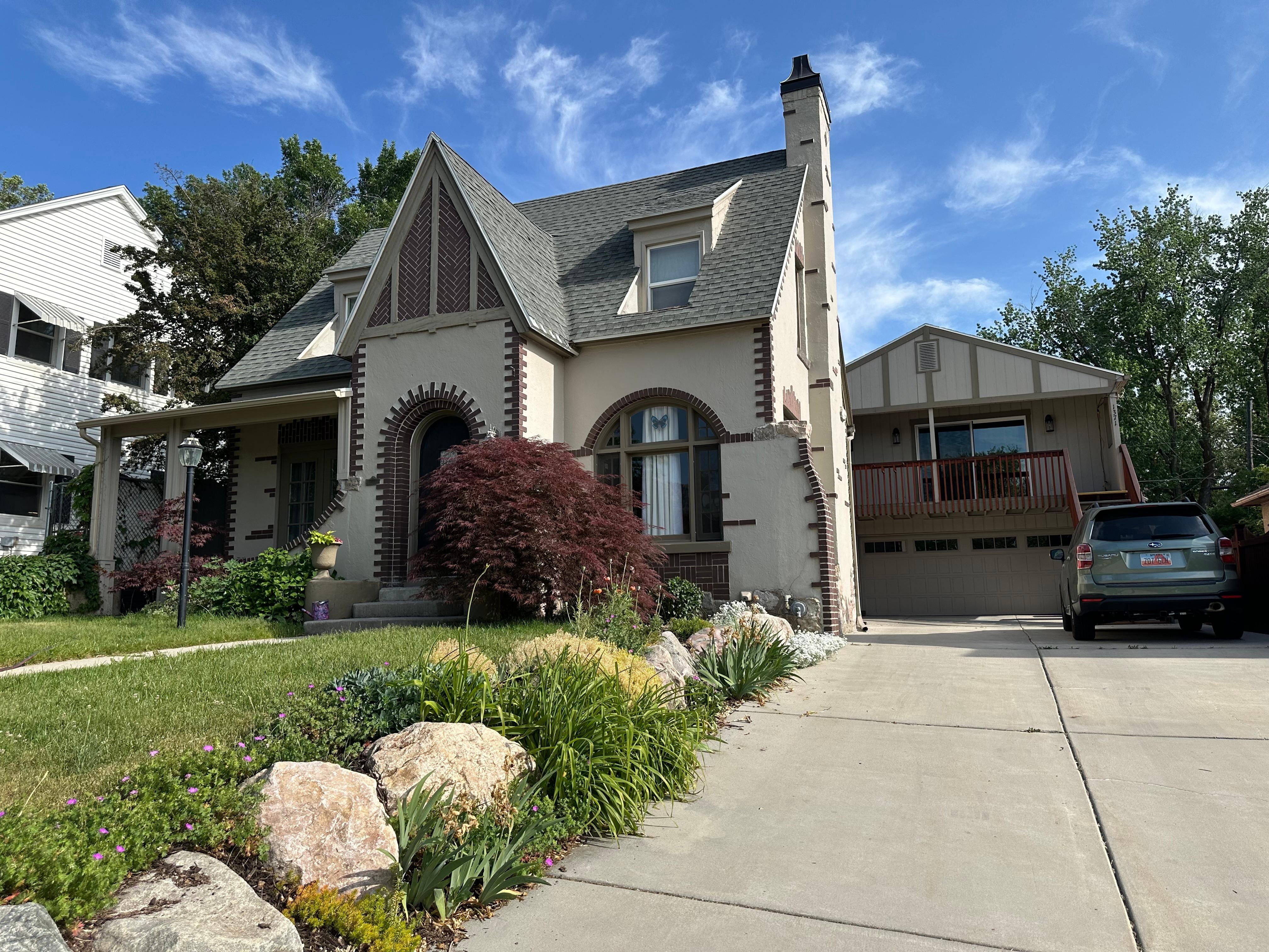 Owner's beautiful home with the gargage apartment on the right. 