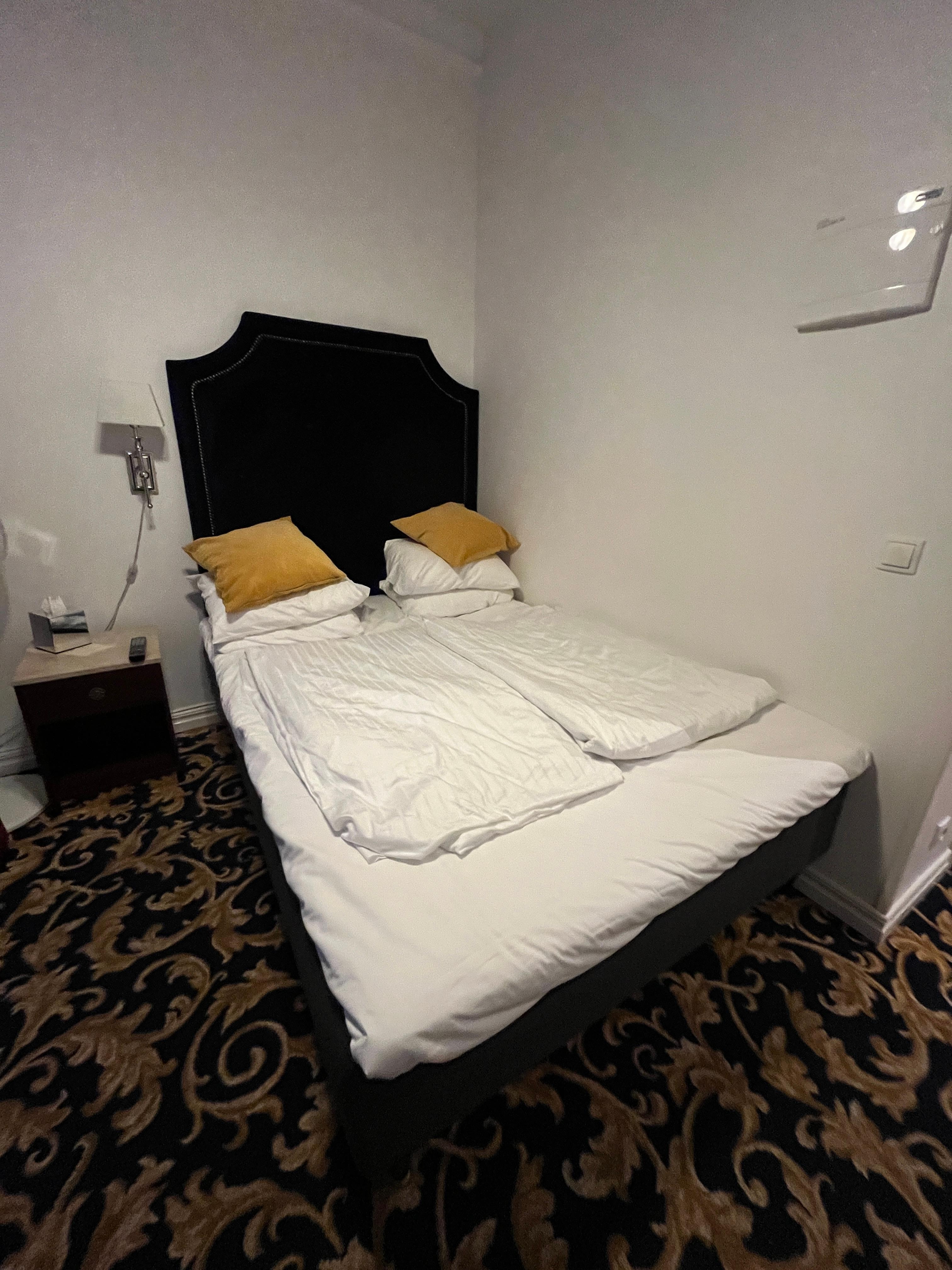 Bed against wall made room feel cramped