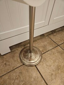 Very rusty toilet paper holder