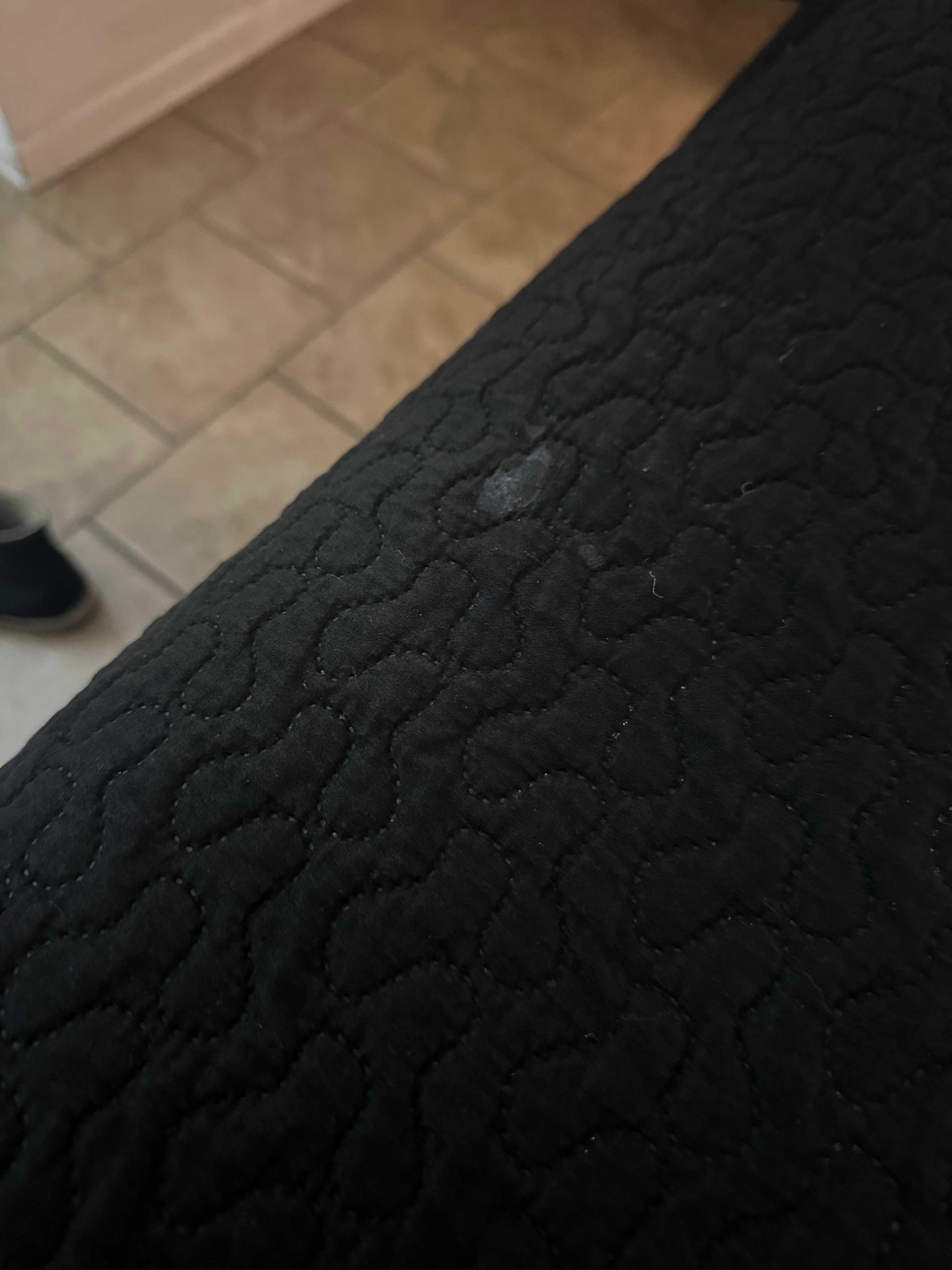 Multiple stains like this on the cover. 