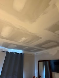 Freshly mudded drywall on the ceiling