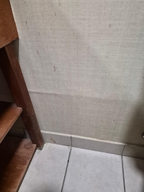 Bathroom wall slattered