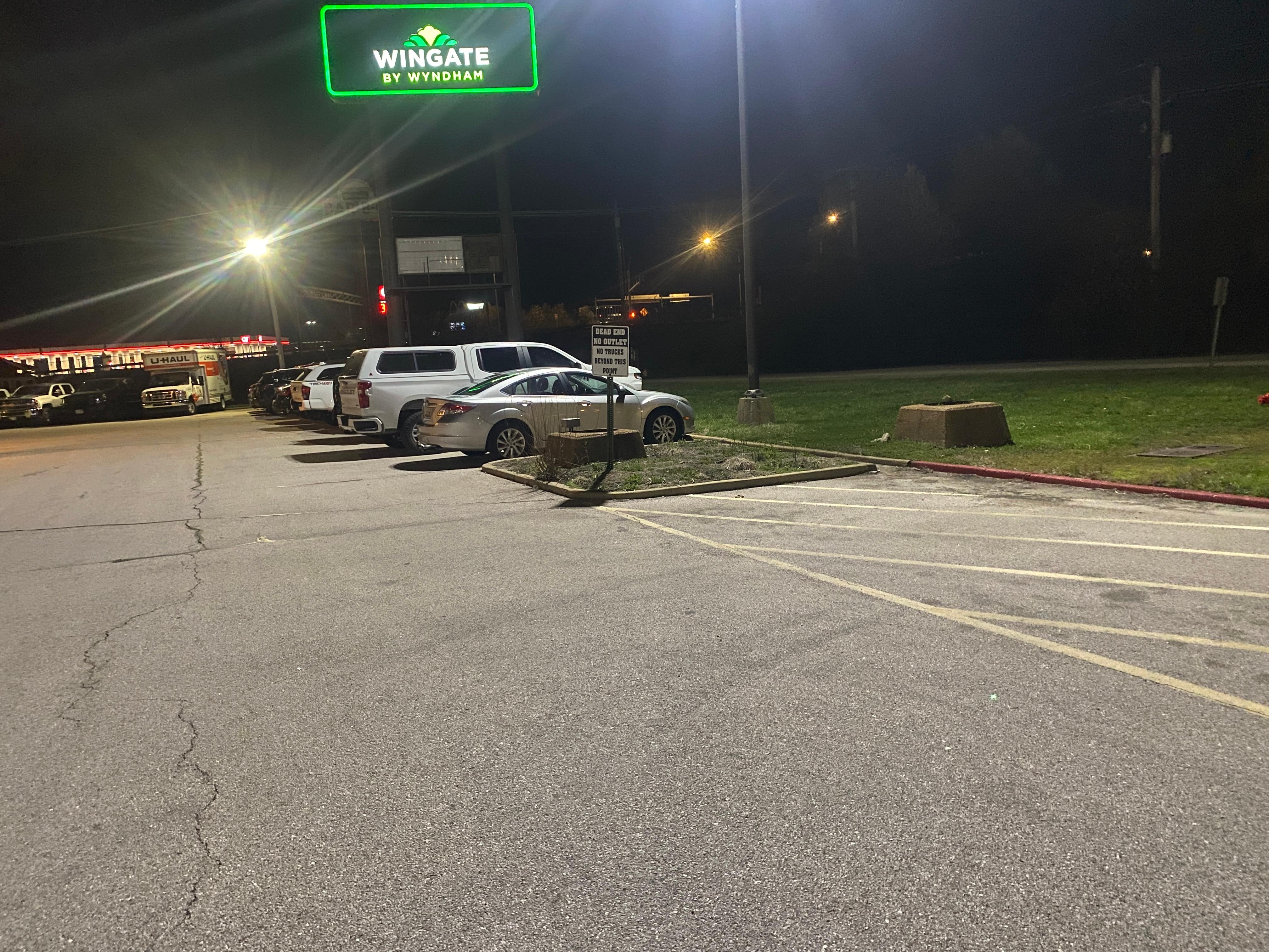 Pulling past hotel check-in puts you onto dead-end path around the hotel made worse because of many spots filled with huge trucks and trailers.  Some flat-bed trailers positioned sideways taking up 4 to 5 parking spaces for guests/families.