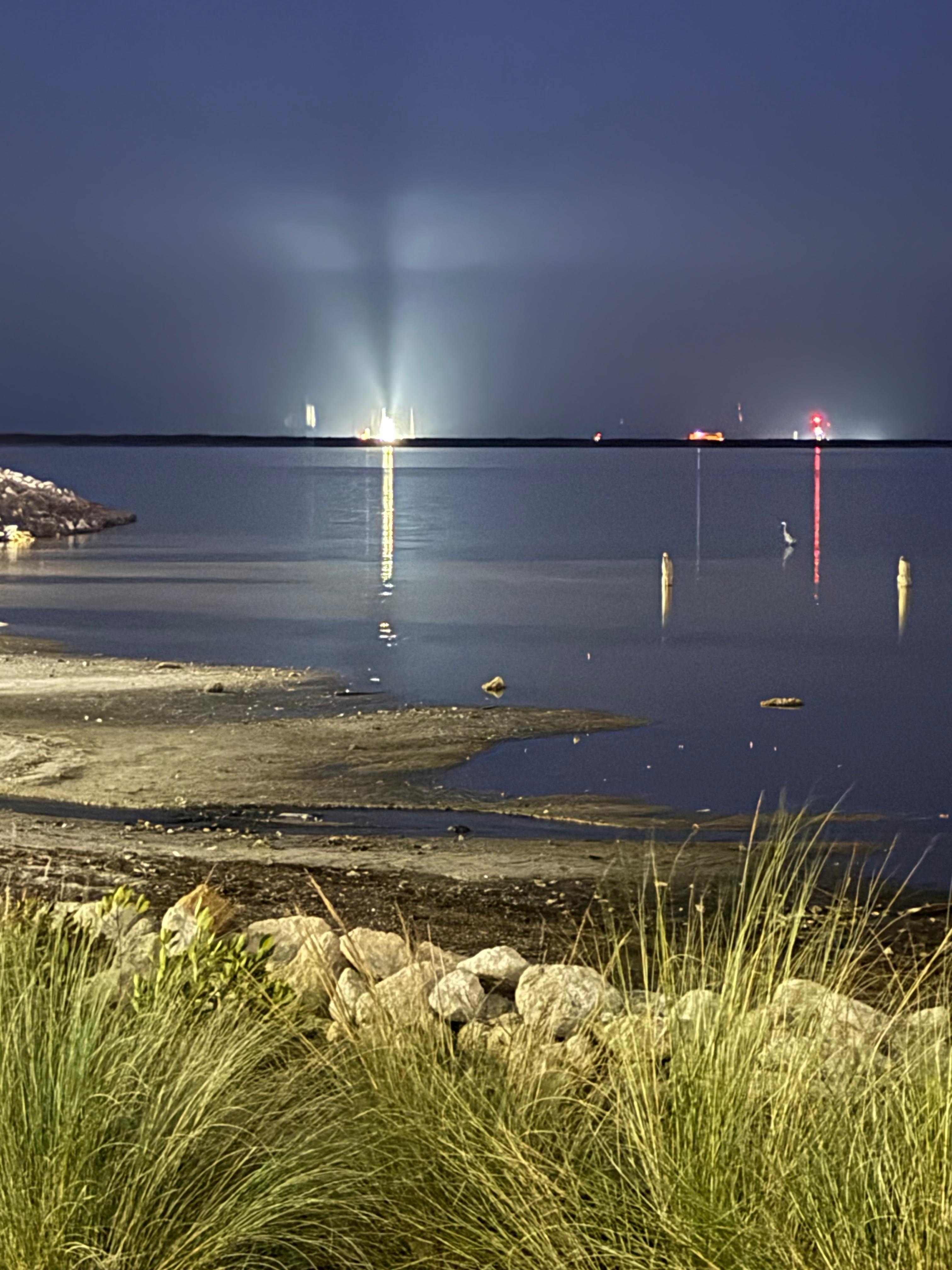 KSC and Artemis II zoomed from behind parking lot