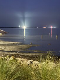 KSC and Artemis II zoomed from behind parking lot