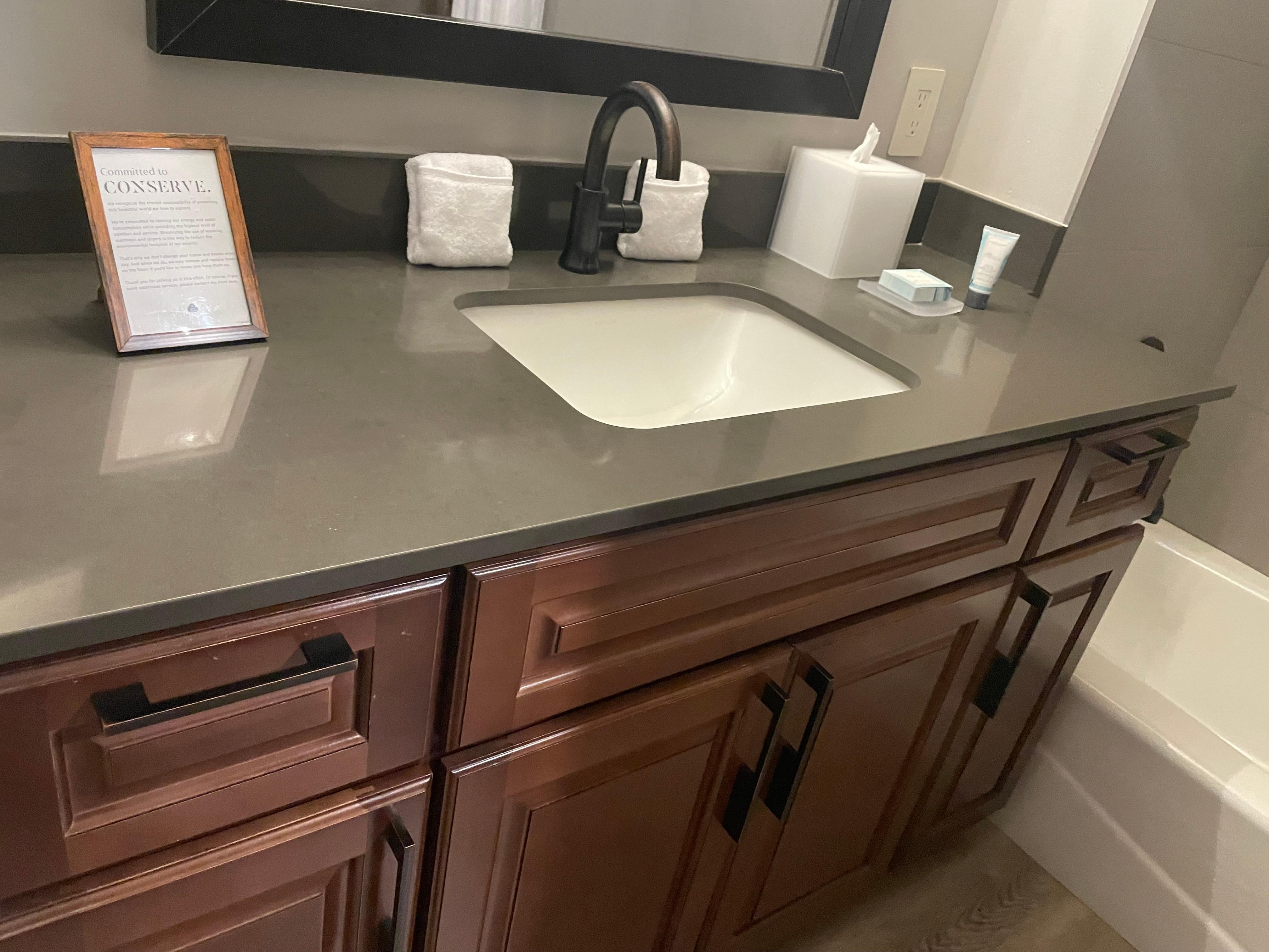 Bathroom (has lighted vanity mirror next to big mirror)