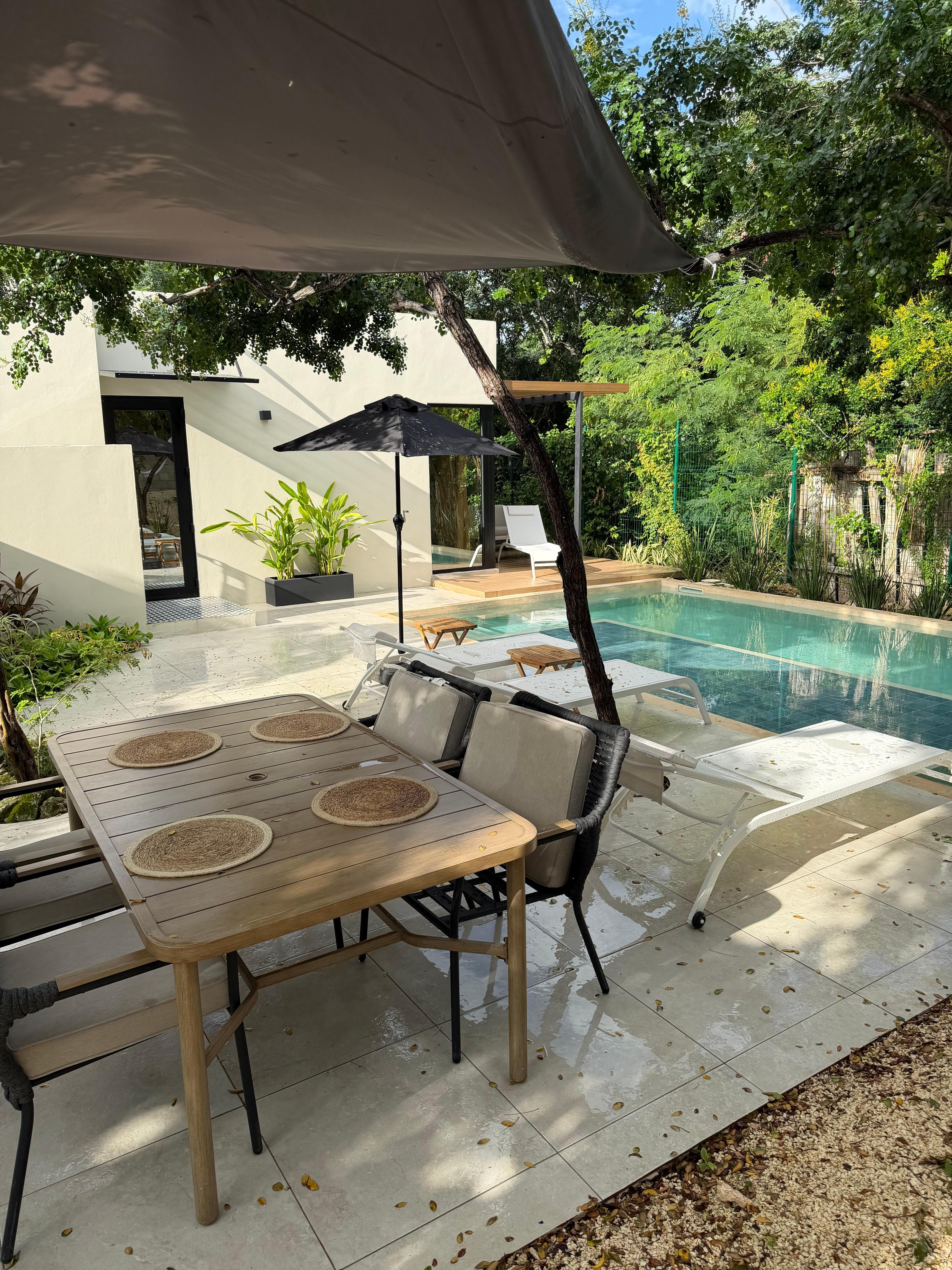 Shaded table by the pool