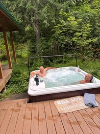 A enjoying hot tub and the beauty of outdoors