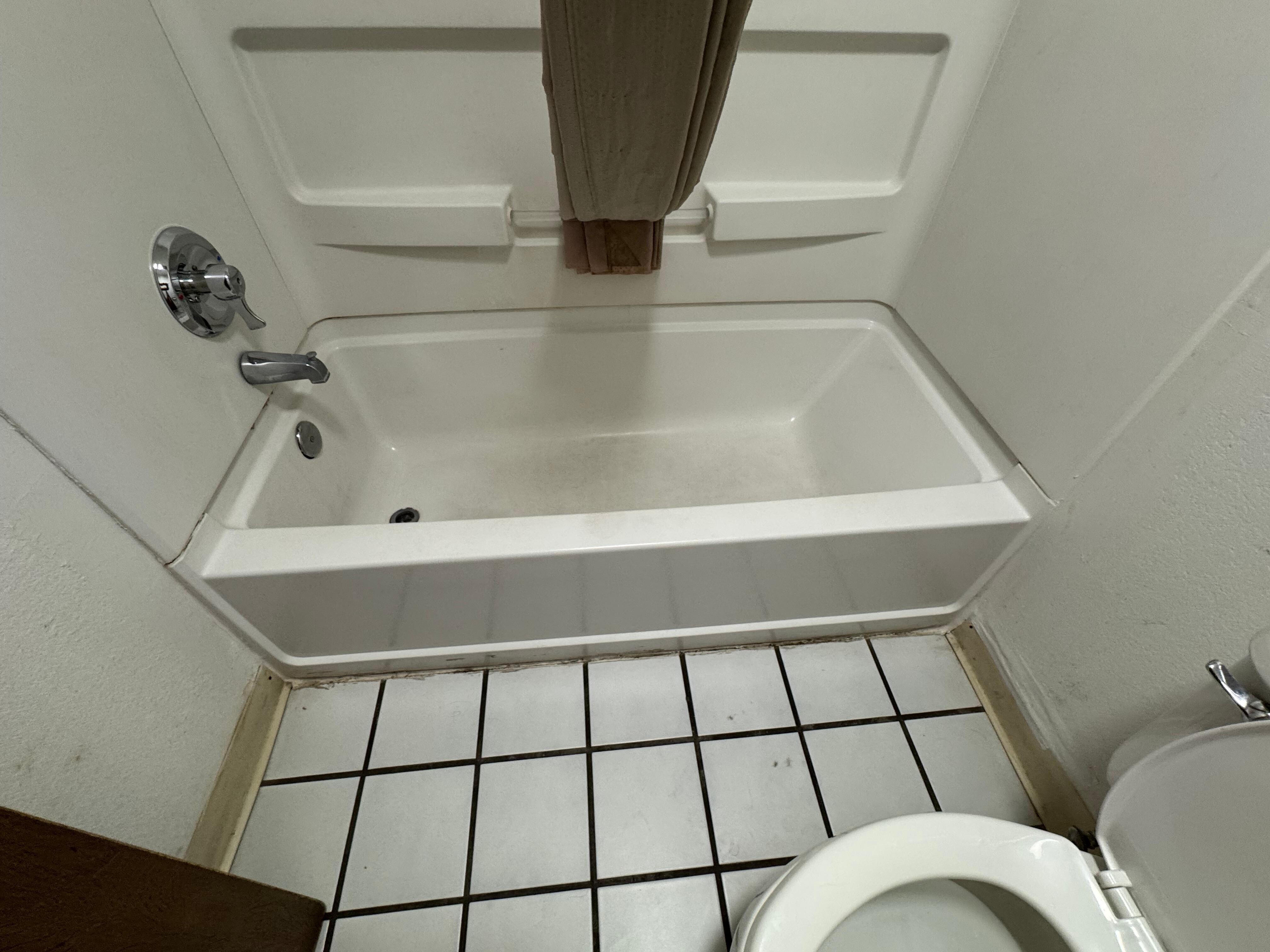 Dirty bathroom tub area