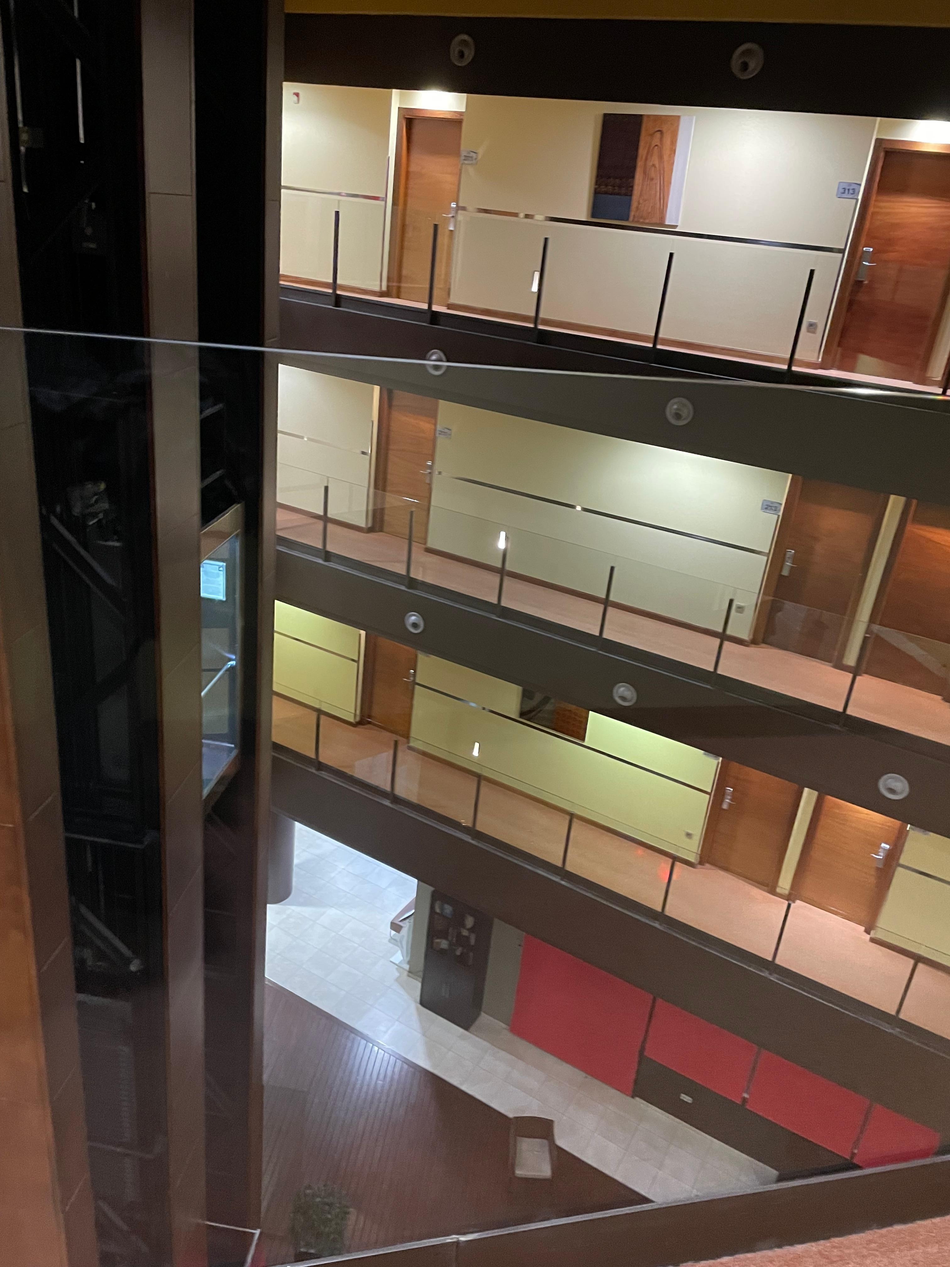 Very cool set up where you can see all the floors from the center and a skylight. A glass elevator too. 